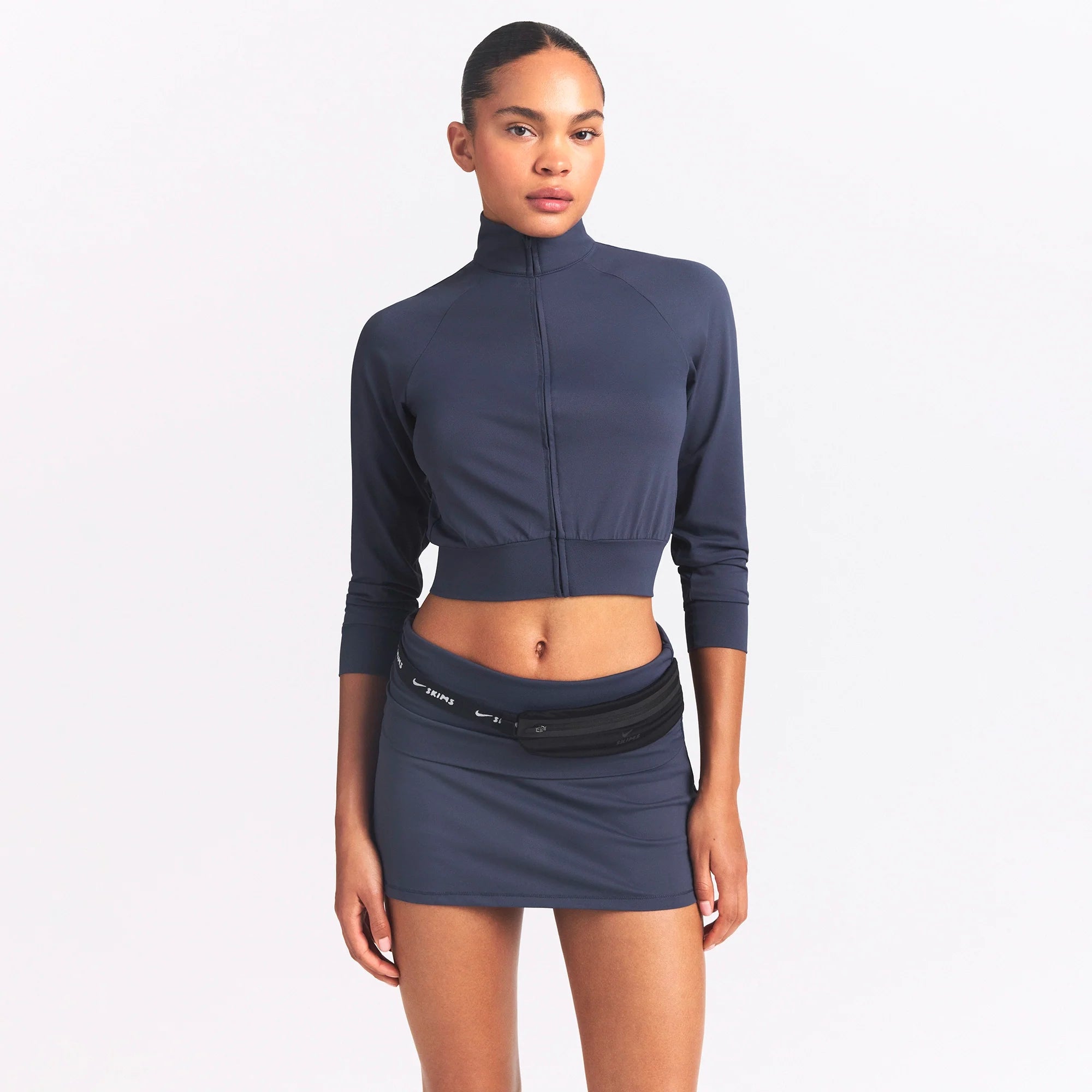 NikeSKIMS AIRY TRACK JACKET | DEEP ROYAL ON A MODEL SIDE VIEW @ | FOCUS: 0.0, 1.0, 0.9
