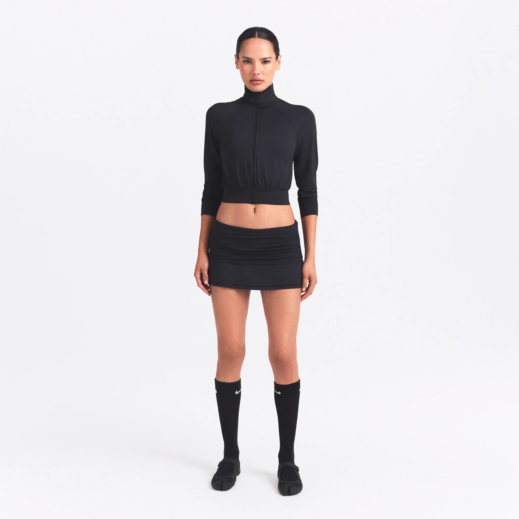 NikeSKIMS AIRY TRACK JACKET | OBSIDIAN ON A MODEL FRONT VIEW @ | FOCUS: 0.0, 1.0, 0.9