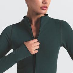 NikeSKIMS VINTAGE SEAMLESS FULL ZIP JACKET | DARK TEAL ON A MODEL SIDE VIEW @ | FOCUS: 0.0, 1.0, 0.9